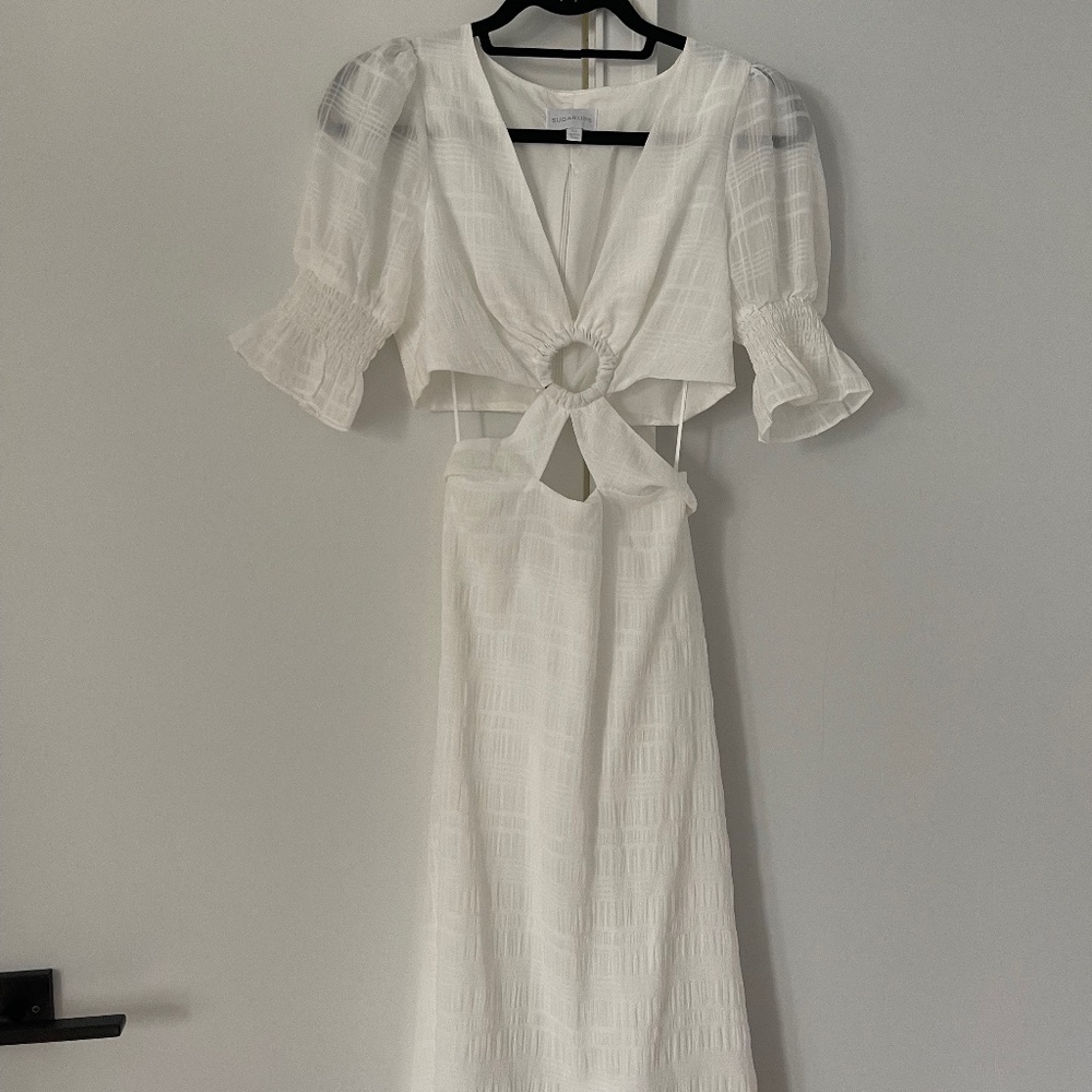 Flowy white dress with cut-outs